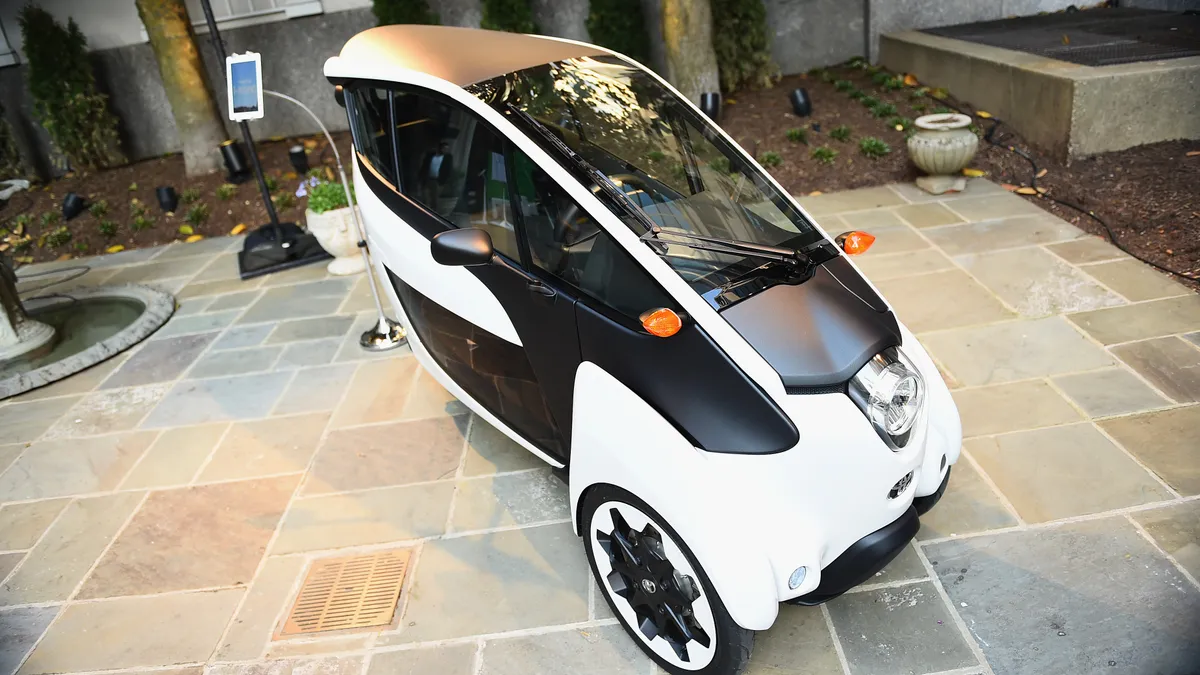 A Toyota i-Road minimobility concept vehicle on display in Washington, D.C.