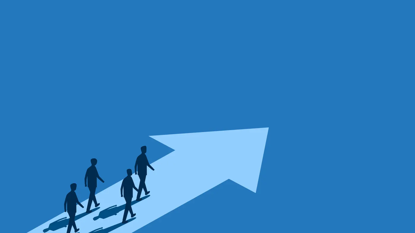 Group of businessmen running along the leading arrow