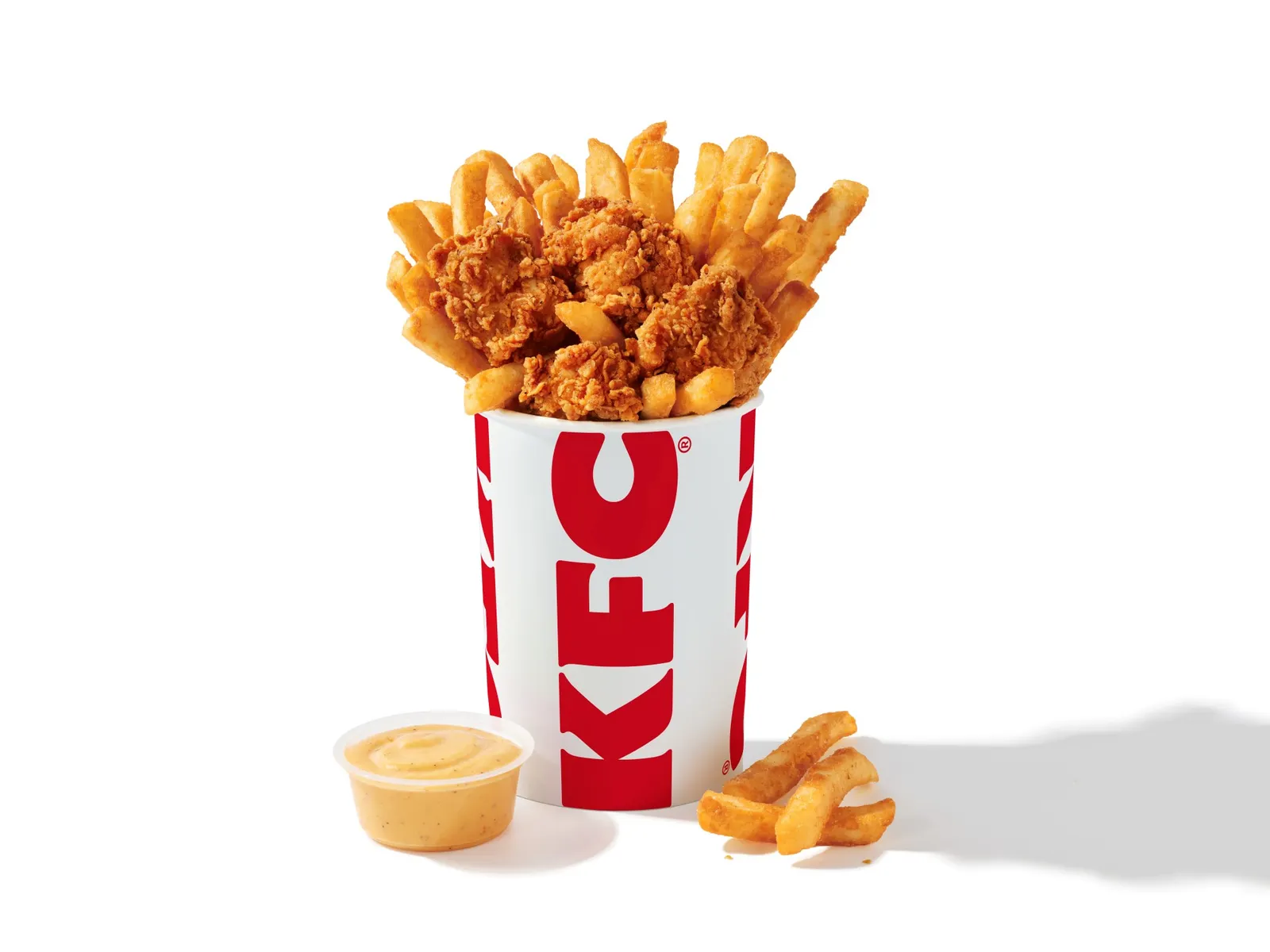 A bucket of chicken nuggets and fries