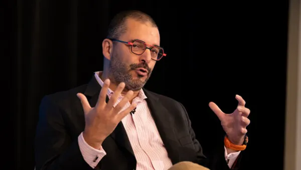 Pascal Belaud gestures with his hands while he speaks.