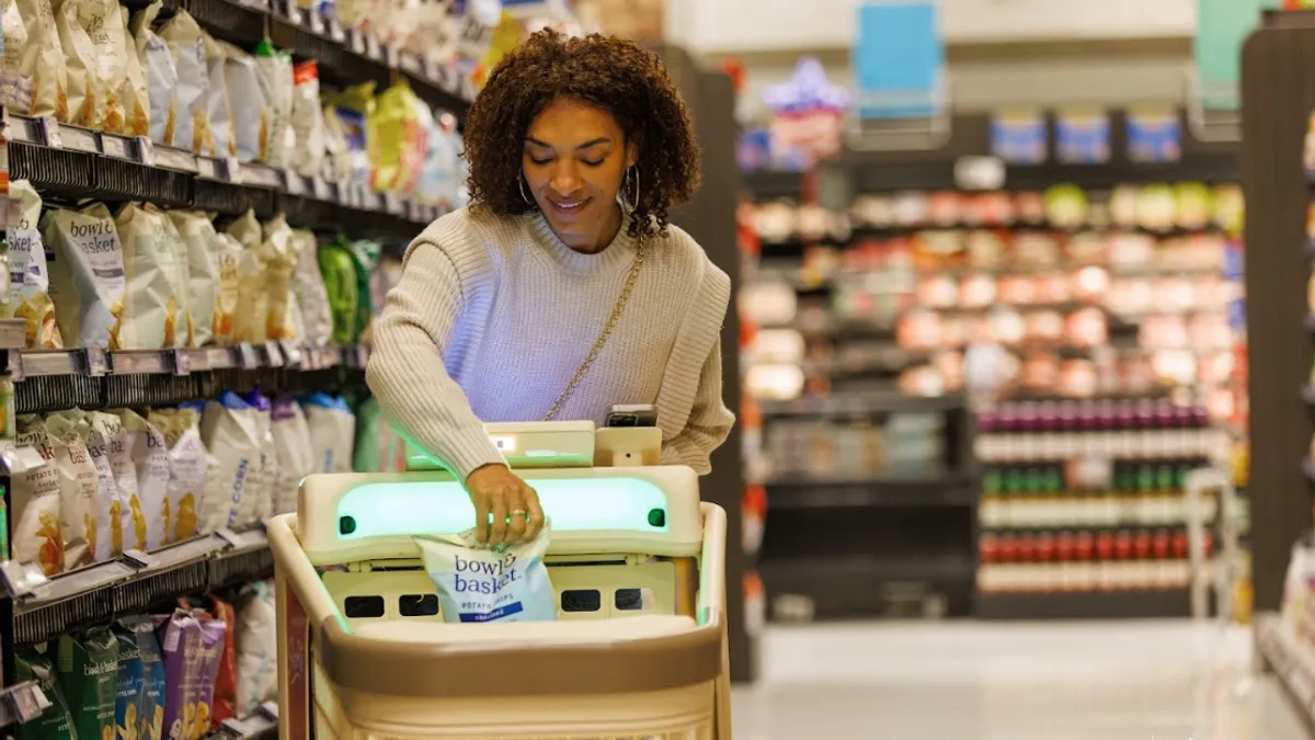 A person in a grocery store putting items in a smart cart.