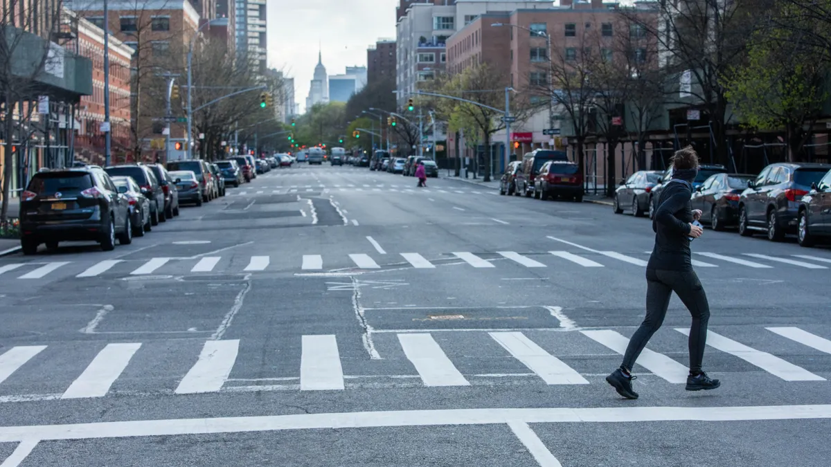 Jogger crossing empty New York street