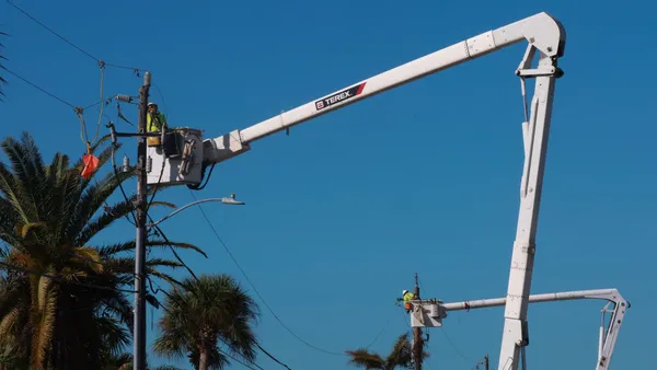 Linemen repair power lines