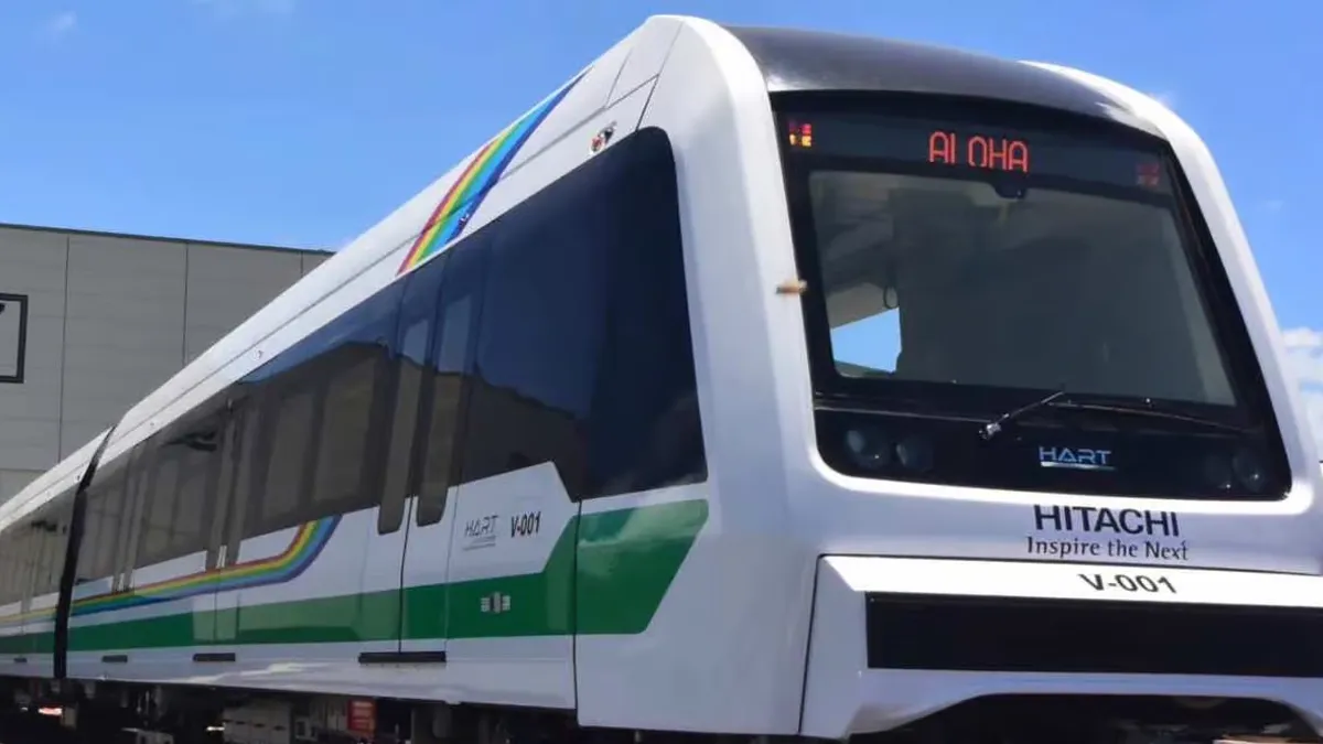 A HART light rail train leaves a station.