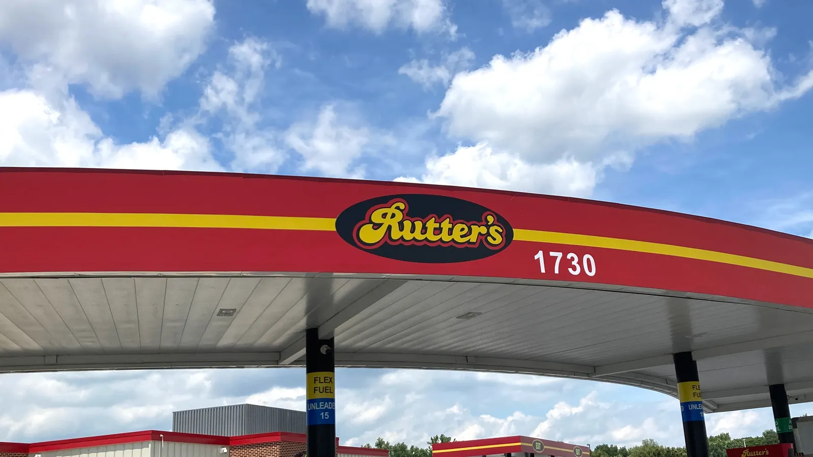 A photo of a red and yellow fuel canopy. A logo on the canopy says &quot;Rutter&#x27;s.&quot;