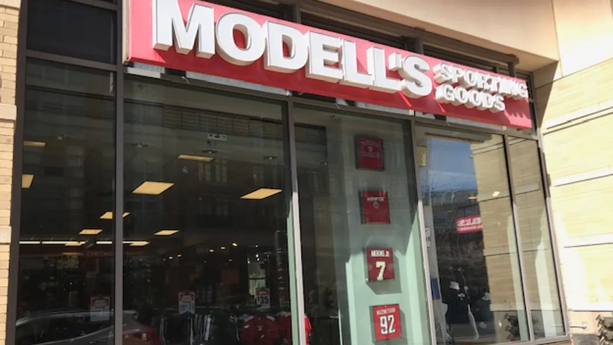 Picture of Modell's storefront.