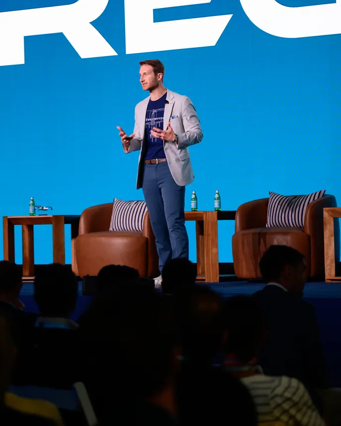 A person on a stage in front of an audience.