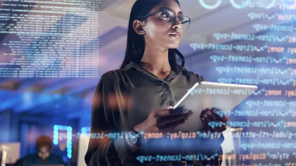 Software, coding hologram and woman on tablet thinking of data analytics, digital technology and night overlay. Programmer or IT person in glasses on 3d screen, programming and cybersecurity research