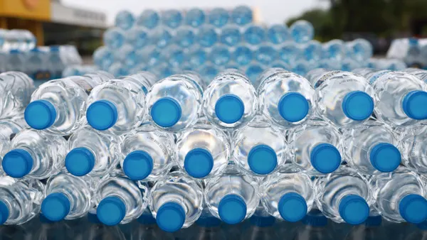A close-up view of stacked PET water bottles.