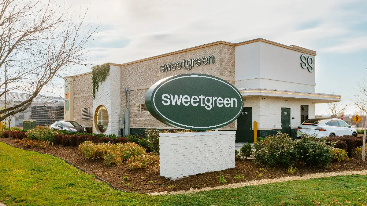 An image of a Sweetgreen restaurant with a drive-thru