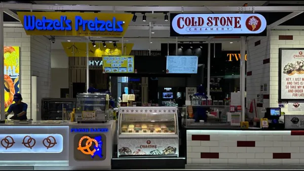 A photograph of a co-branded Wetzel's Pretzels and Cold Stone Creamery inside a mall.