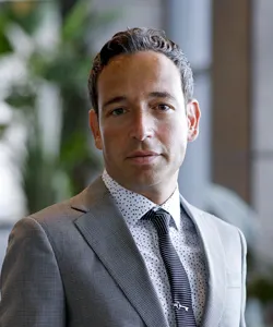 Head shot of person wearing a suit