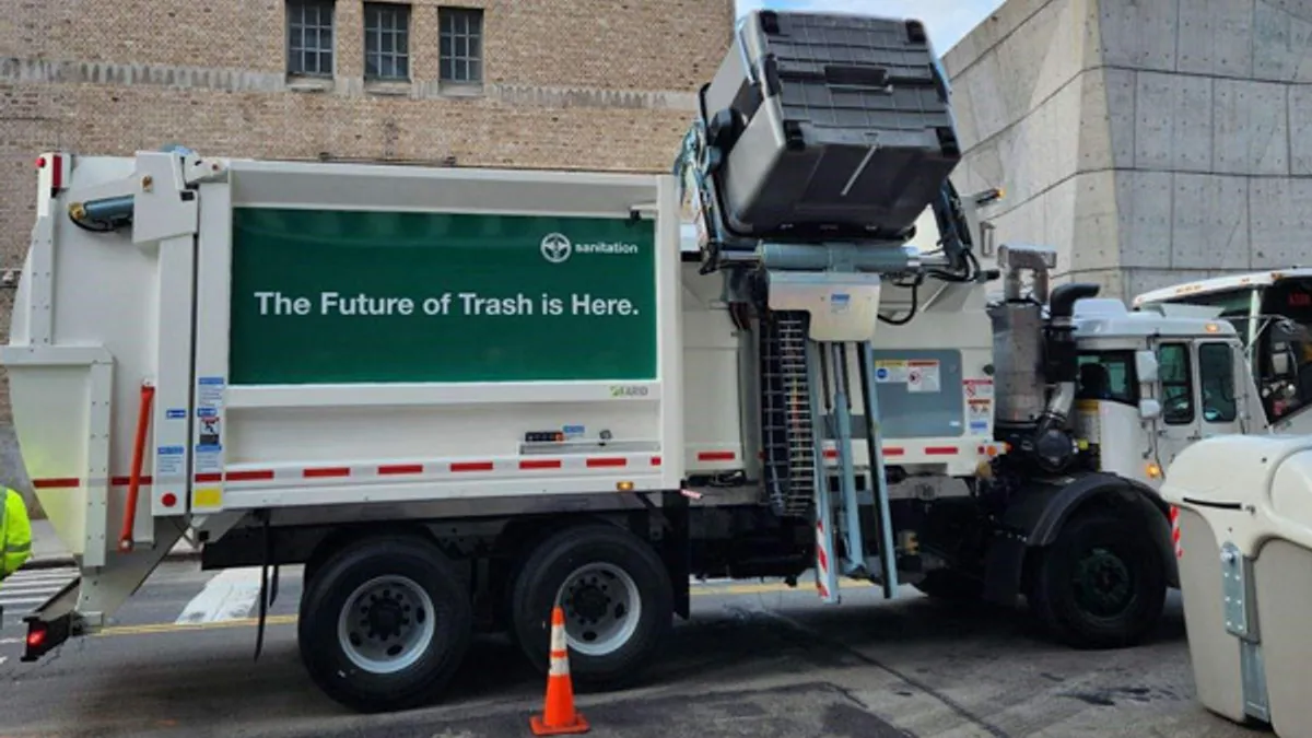 Sideview of a DSNY automated sideloader waste truck prototype in Manhattan