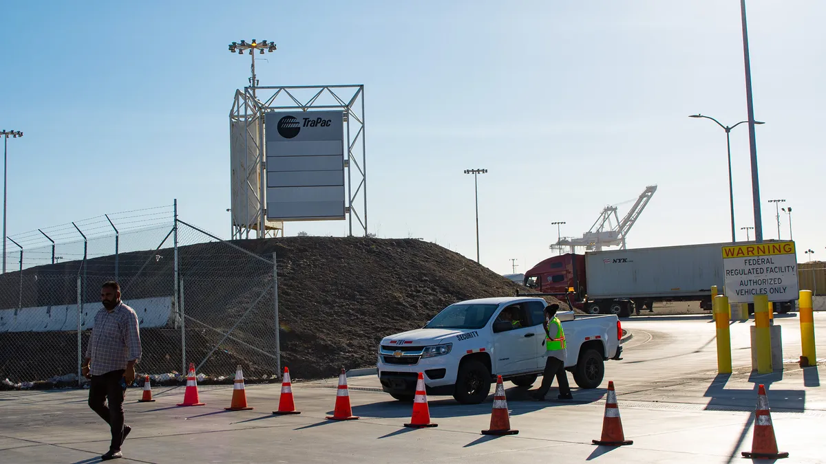 Officials close truck access to the Trapac terminal at the Port of Oakland, in response to an owner-operator led protest on July 18, 2022.