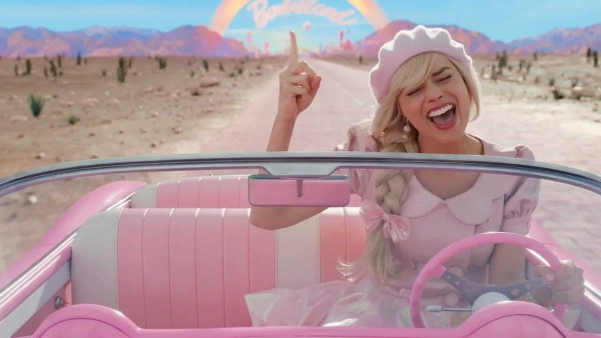 Actor Margot Robbie driving car in the movie "Barbie."