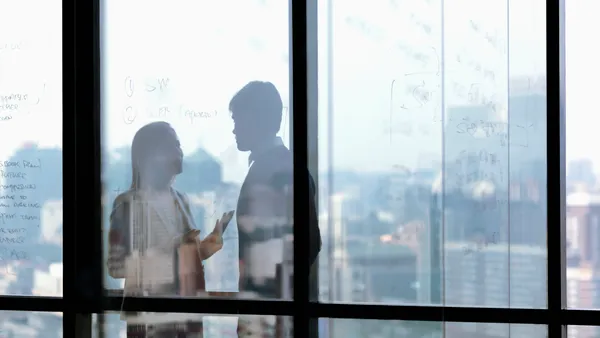 Silhouette shadows of business people talking in office