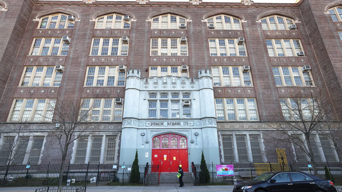 A person walks past the entrance the PS 179 school building on November 19, 2020 in New York City.