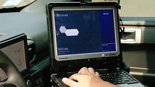 Laptop open and user is accessing software