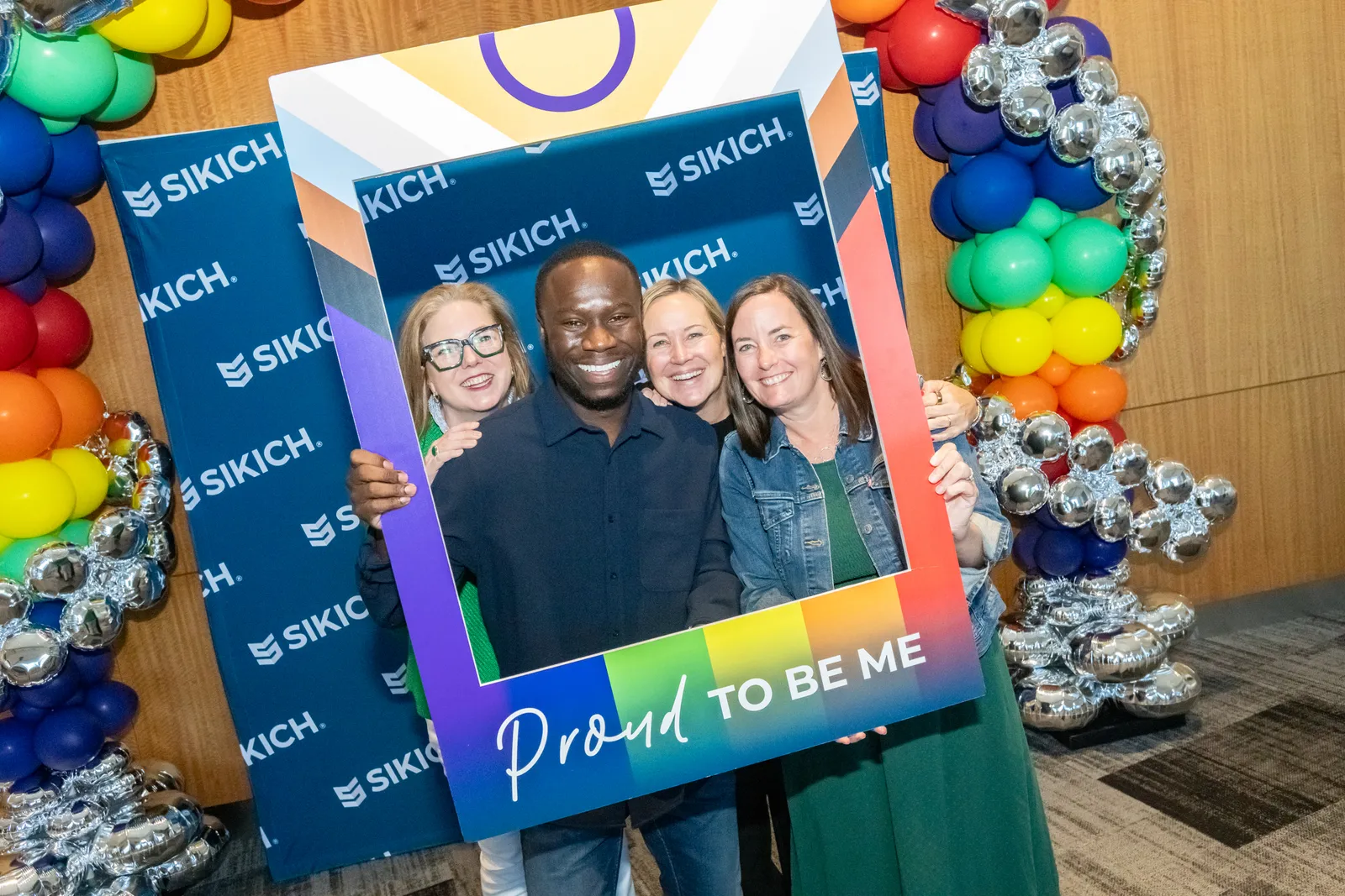 Sikich Pride Employee Resource Group members gather for a photo.