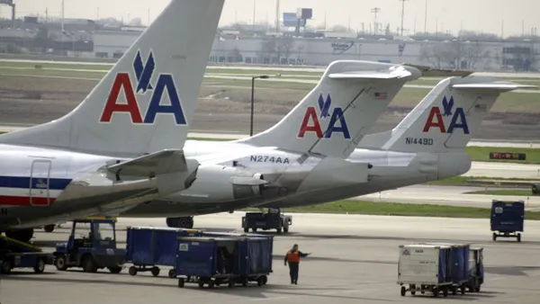 American Airlines jets sit on the tarmac as an American Eagle jet taxis to the gate at O'Hare International Airport April 25, 2003 in Chicago.