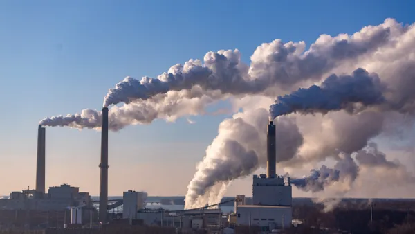 Wind is blowing pollution from a coal burning power plant.
