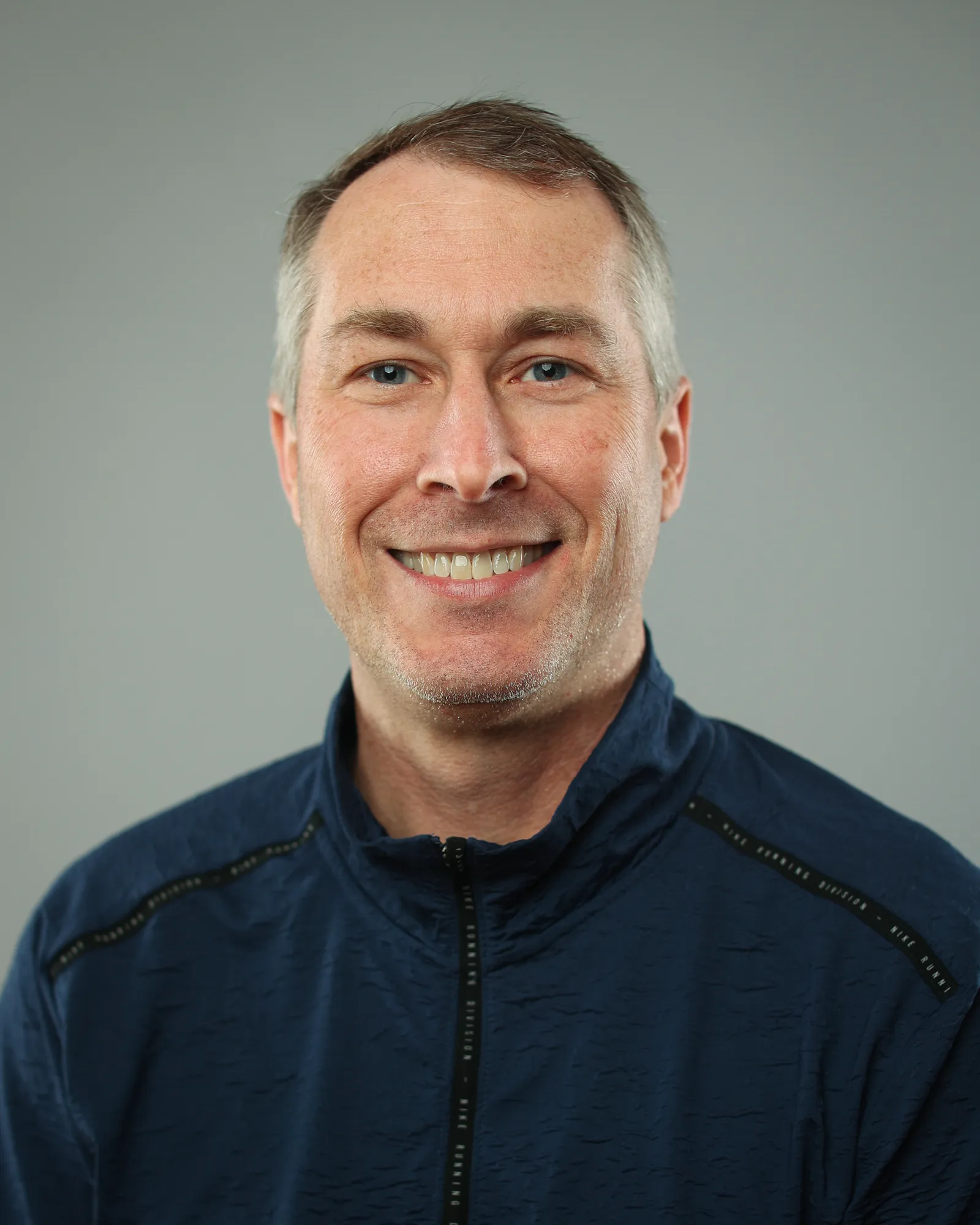 A headshot of a middle age white man.