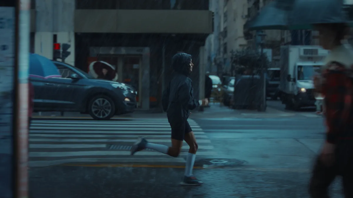 A person running in the rain for a Nike ad