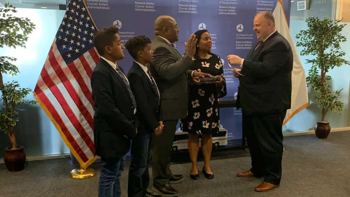 Earl Adams Jr. is sworn in as deputy administrator of the FMCSA.