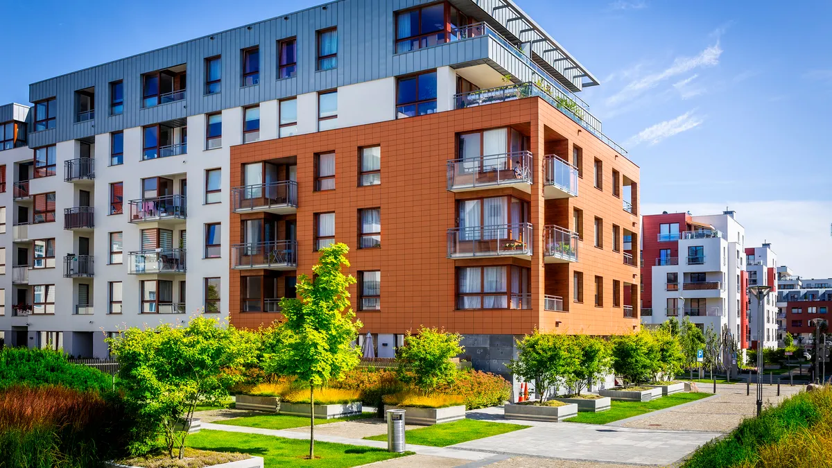 Walkway leading along the new colorful cmplex of apartment buildings, Gdansk, Poland