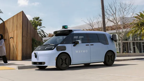 A blue Waymo autonomous passenger van designed in partnership with China-based electric automaker Zeekr.