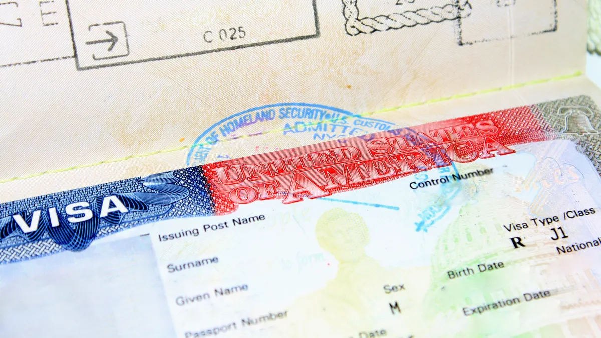 A federal document that says "VISA United States Of America" above a J1 type/class distinction.