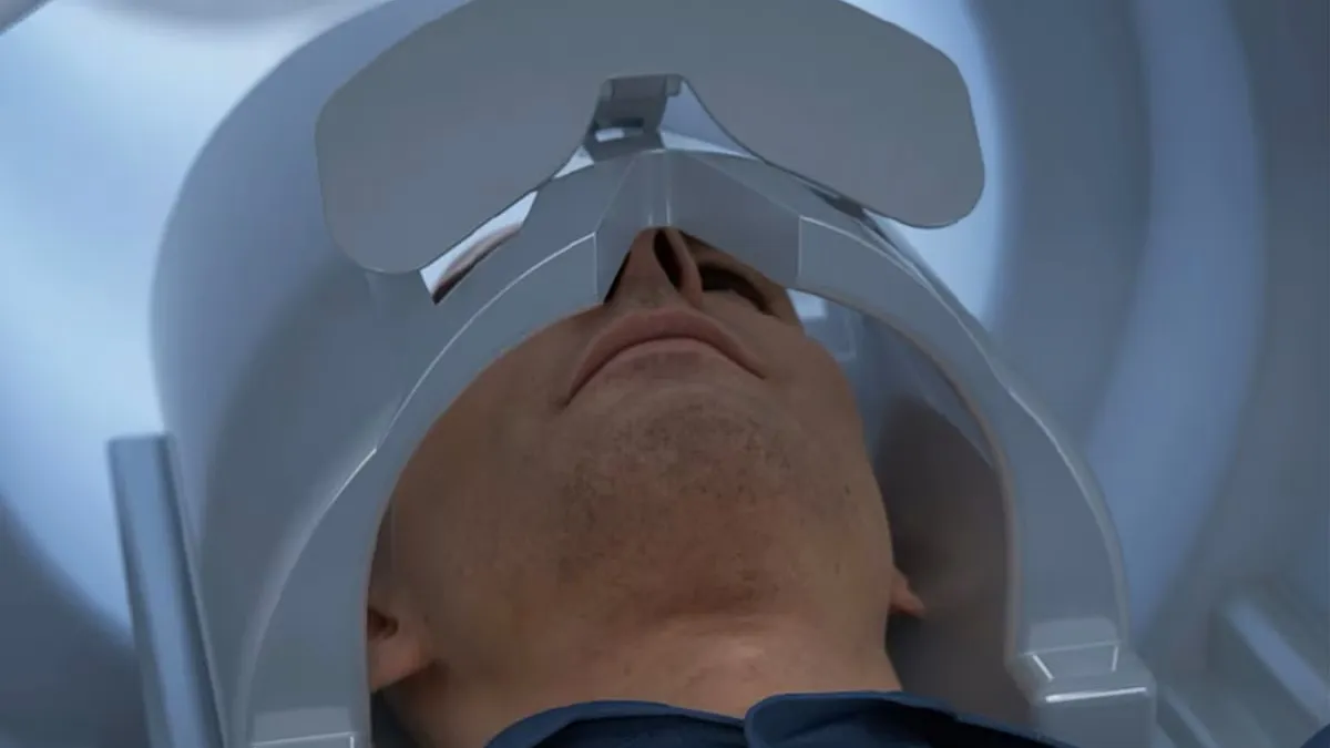 A person head is shown inside GE Healthcare's Signa Magnus MRI machine.