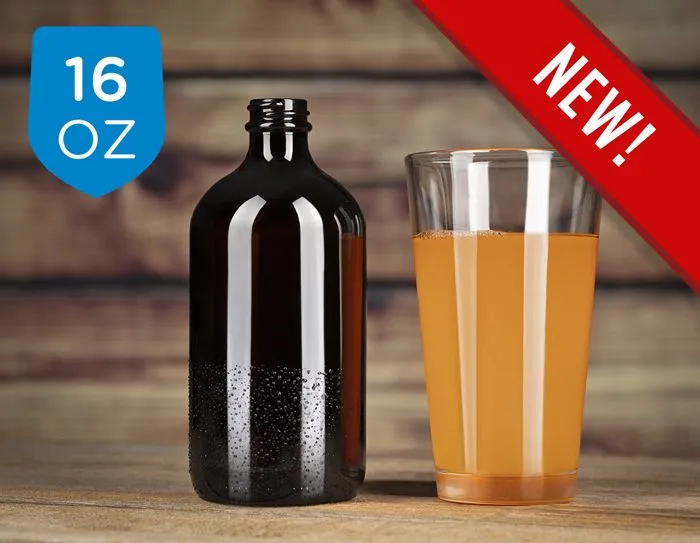 A brown glass bottle next to a pint glass that contains a golden liquid.