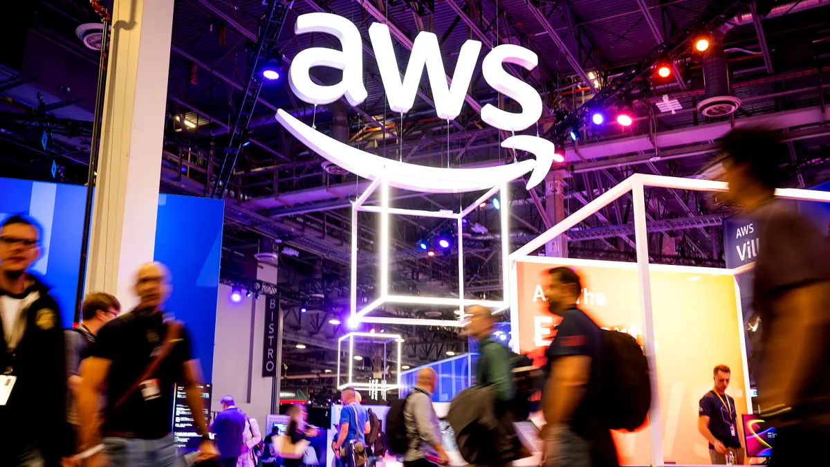 Attendees walk through an expo hall during AWS re:Invent 2022, a conference hosted by Amazon Web Services, at The Venetian Las Vegas on November 29, 2022 in Las Vegas, Nevada. (