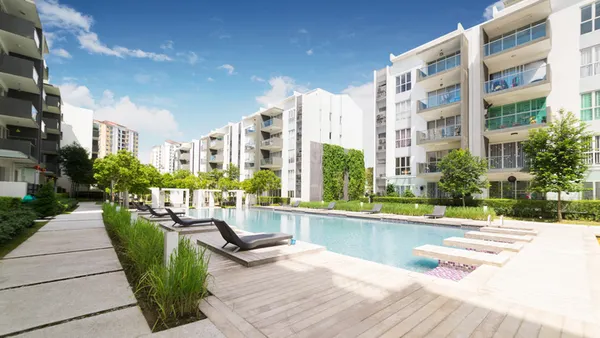 Modern white apartments with a pool