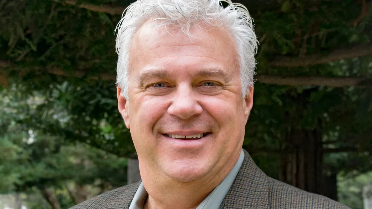 A headshot shows Kitchell CEM president Don Haase in casual business attire.