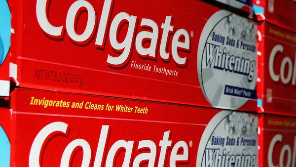 Packages of Colgate toothpaste on display at market