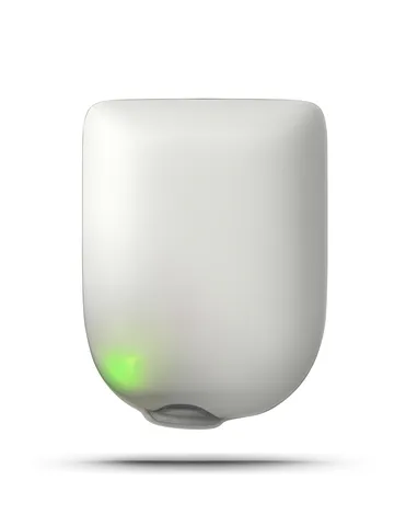 A white device with a rounded edge and a green light