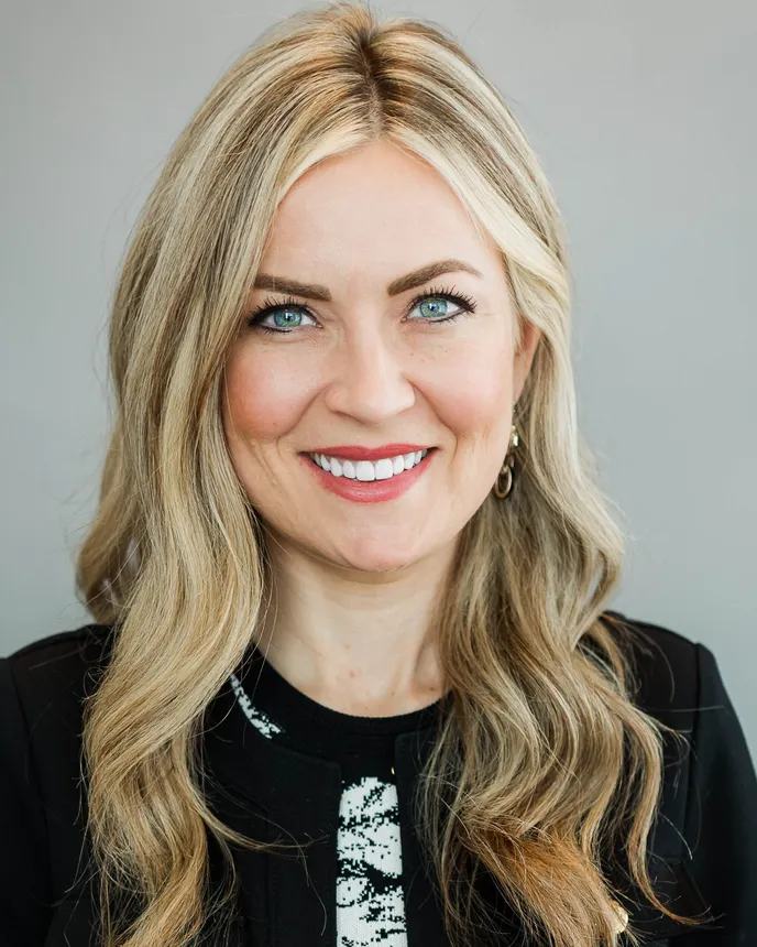 Headshot of a woman in business attire.