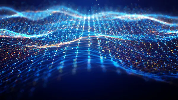 Abstract network wave and glowing blue and orange particle data on dark background.
