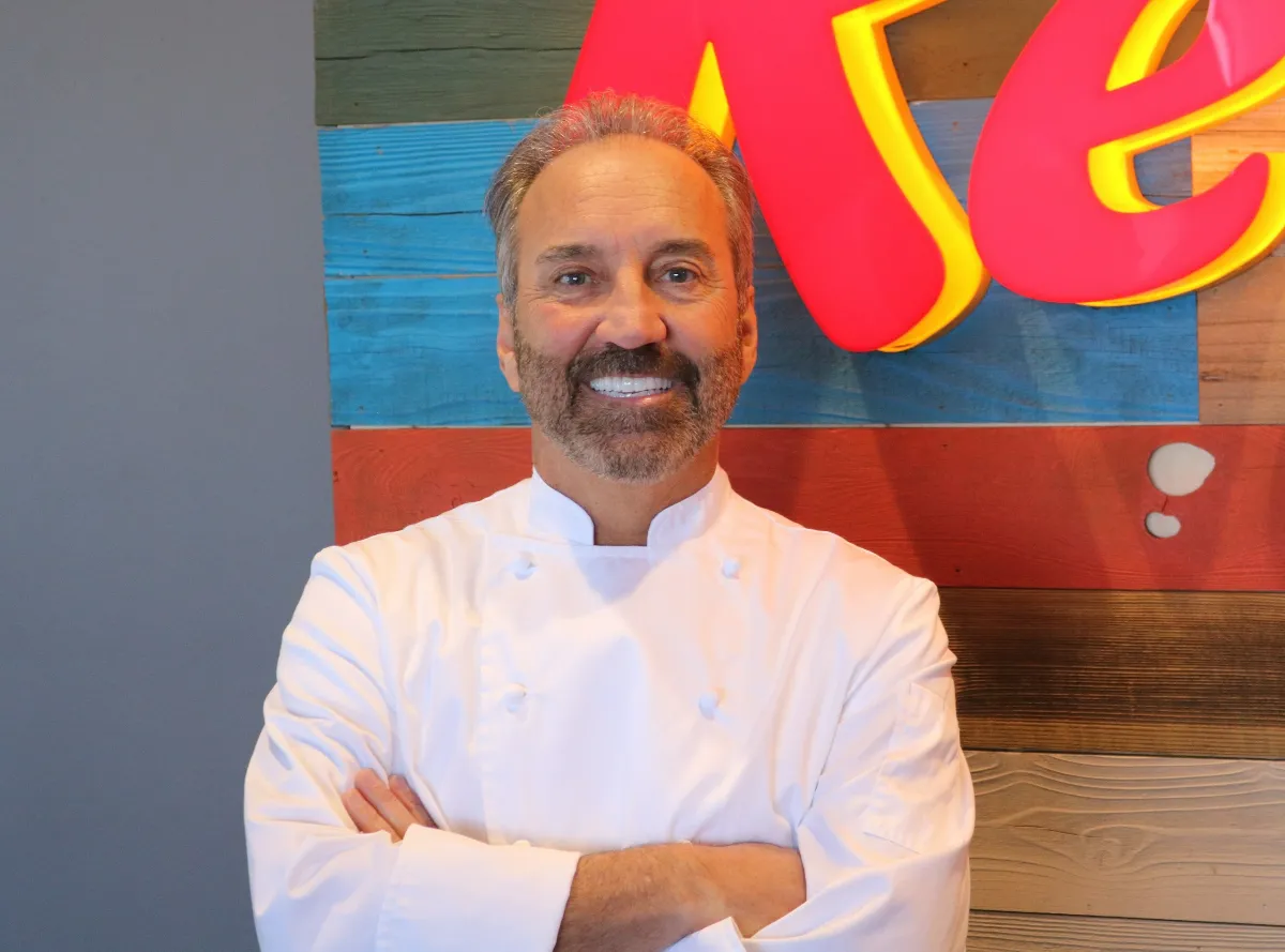 A photo of a chef in a white coat.