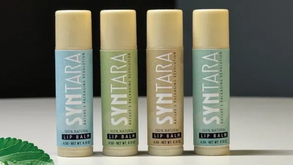 Four tubes of lip balm with different colors of labels.