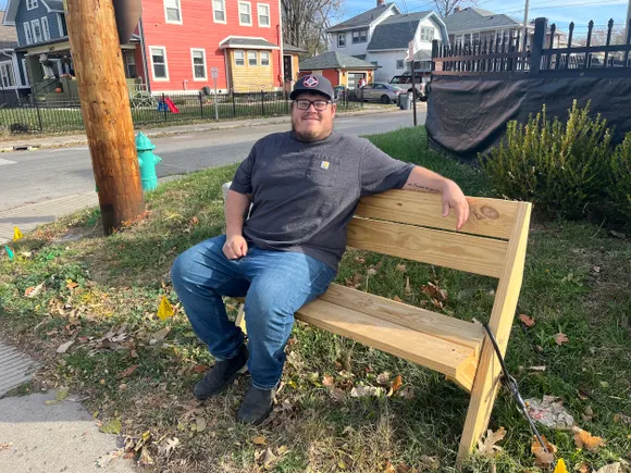 There was no place for his family to sit. Now the ‘Bench Mench’ has installed 22 benches in Indianapolis.