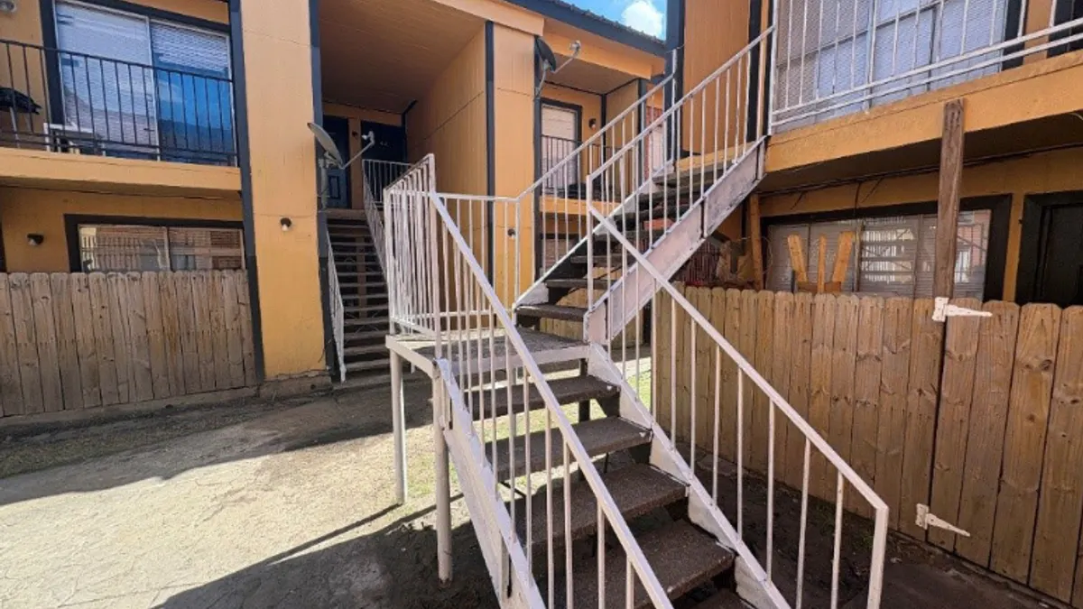 Rusty stairs covered in paint.