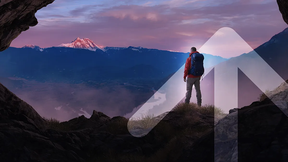 Man standing on top of mountain