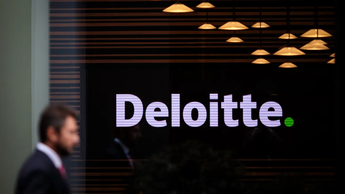 The Deloitte logo is shown on an office building.