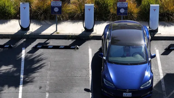Shot of Tesla vehicle at charging station