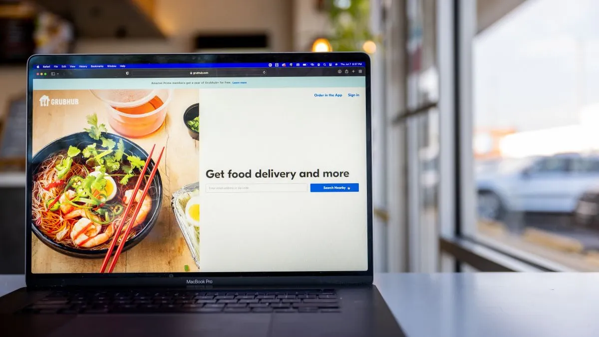 An image of a laptop with Grubhub's website.