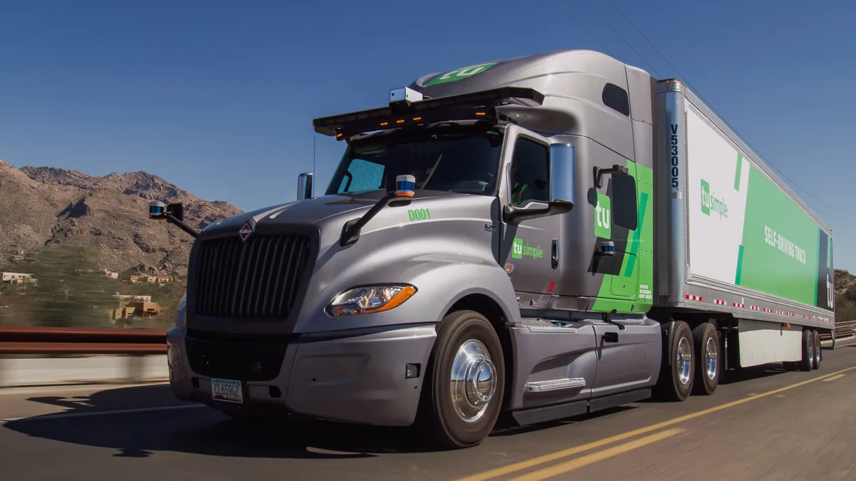 A TuSimple autonomous truck driving on a highway