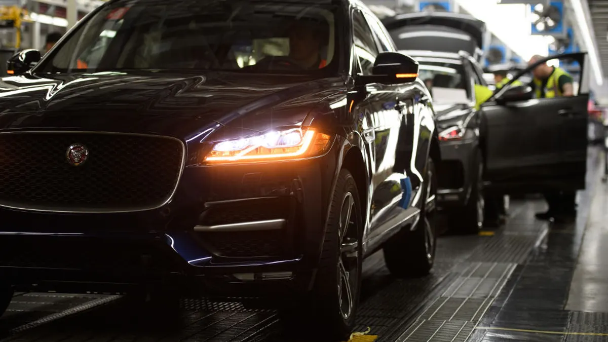 Vehicles are checked before moving to the next stage of production at the Jaguar Land Rover factory on March 1, 2017 in Solihull, England.